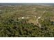 Nice aerial view of wooded acreage featuring a home with an outbuilding at 600 Tabatha Dr, Osteen, FL 32764