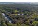 Desirable aerial view of wooded acreage featuring a home with an outbuilding at 600 Tabatha Dr, Osteen, FL 32764