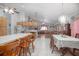 Open concept dining area featuring tile flooring and views of kitchen and living room at 600 Tabatha Dr, Osteen, FL 32764