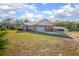 A sprawling single-story brick home features an attached garage and metal roof at 600 Tabatha Dr, Osteen, FL 32764