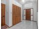 Bright foyer featuring tile flooring, a coat closet, and natural light through sidelight windows at 600 Tabatha Dr, Osteen, FL 32764