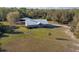 Charming home with a metal roof and a well-manicured lawn, creating an inviting curb appeal at 600 Tabatha Dr, Osteen, FL 32764