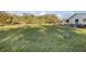 Wide-open grassy lot with surrounding trees, ready for your custom home or outdoor activities at 600 Tabatha Dr, Osteen, FL 32764