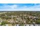 Panoramic aerial view of a residential neighborhood with mature trees and clear blue skies at 617 S Flamingo Dr, Holly Hill, FL 32117