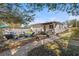 Landscaped backyard with stone path, seating area, and lush greenery offering a serene outdoor space at 617 S Flamingo Dr, Holly Hill, FL 32117