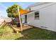 Backyard showcasing a wooden deck with sunshade, two Adirondack chairs and privacy fence at 617 S Flamingo Dr, Holly Hill, FL 32117