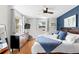 Bright bedroom showcasing hardwood floors, ceiling fan, and great natural light from two windows at 617 S Flamingo Dr, Holly Hill, FL 32117
