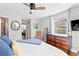 Bedroom with a large window, hardwood floors, and a dresser for ample storage at 617 S Flamingo Dr, Holly Hill, FL 32117