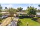 Charming home with a lush green lawn, mature trees, and a welcoming driveway at 617 S Flamingo Dr, Holly Hill, FL 32117