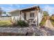 Charming single-story home featuring a cozy, covered porch with comfortable seating at 617 S Flamingo Dr, Holly Hill, FL 32117