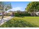 Charming single-story home featuring a well-kept lawn and mature landscaping at 617 S Flamingo Dr, Holly Hill, FL 32117