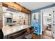Modern kitchen featuring stone and wood accents, a sleek island, and stainless steel appliances at 617 S Flamingo Dr, Holly Hill, FL 32117