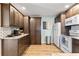 Spacious kitchen with stainless steel appliances, dark wood cabinetry and granite countertops at 617 S Flamingo Dr, Holly Hill, FL 32117