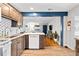Open kitchen with granite counters, and breakfast bar that opens up to the living room at 617 S Flamingo Dr, Holly Hill, FL 32117
