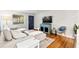 Bright living room with hardwood floors, comfy sectional sofa, and stylish decor at 617 S Flamingo Dr, Holly Hill, FL 32117