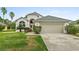 Charming single-Gathering home with mature landscaping and a two-car garage at 6408 Whit Ct, Port Orange, FL 32128