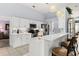 Bright kitchen boasting white cabinets and stainless steel appliances at 6408 Whit Ct, Port Orange, FL 32128