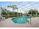 Inviting pool with a screened enclosure and views of the beautiful lake in the backyard at 6408 Whit Ct, Port Orange, FL 32128