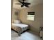 Comfortable bedroom featuring a ceiling fan and natural light from the window at 761 Greenway Pl, Daytona Beach, FL 32114