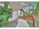 Inviting front entrance with modern awning, walkway, landscaping, and natural stone accents at 761 Greenway Pl, Daytona Beach, FL 32114