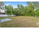 Large grassy backyard offers plenty of space and includes a concrete patio for relaxing and entertaining at 815 Charles Ave, Orange City, FL 32763