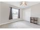 Comfortable bedroom features carpeted floors, natural light from a window and a closet at 815 Charles Ave, Orange City, FL 32763