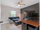 Comfortable bedroom with an office set up, natural light and a modern design at 815 Charles Ave, Orange City, FL 32763