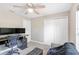 Versatile bedroom features comfortable chair, modern monitors, and a spacious closet at 815 Charles Ave, Orange City, FL 32763