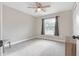 Neutral bedroom features ample space, carpeted floors, a window for natural light and closet at 815 Charles Ave, Orange City, FL 32763