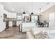 Modern kitchen with stainless steel appliances and island, seamlessly connected to the dining area at 815 Charles Ave, Orange City, FL 32763