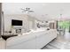 Open-concept living room with modern furnishings and seamless transition to the kitchen at 815 Charles Ave, Orange City, FL 32763