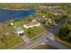 The home's location near a beautiful lake and well-kept lawns are showcased in this high-angle aerial view at 902 Cloverleaf Blvd, Deltona, FL 32725