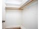 A walk-in closet with white walls, shelving, and carpet at 902 Cloverleaf Blvd, Deltona, FL 32725