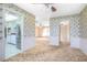 View from dining area showing the open floor plan and transition to the kitchen and other living spaces at 902 Cloverleaf Blvd, Deltona, FL 32725
