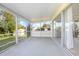 Screened in porch with a view of the backyard at 902 Cloverleaf Blvd, Deltona, FL 32725