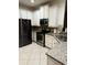 Well-equipped kitchen with stainless steel appliances, granite countertops, and white cabinets at 1812 Leather Fern Dr, Ocoee, FL 34761