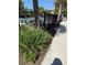 Community pool enclosed with a black metal fence and some shrubbery at 1812 Leather Fern Dr, Ocoee, FL 34761