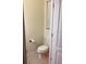 Clean powder room featuring neutral walls, a toilet, and minimal decor at 1812 Leather Fern Dr, Ocoee, FL 34761