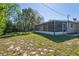 Backyard view of the home's screened patio at 1020 Alladin Dr, Deltona, FL 32725