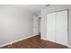 This bedroom features stylish hardwood floors and a large closet for ample storage at 1020 Alladin Dr, Deltona, FL 32725