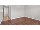 A bright bedroom featuring hardwood floors and neutral-colored walls at 1020 Alladin Dr, Deltona, FL 32725