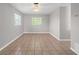 Bedroom featuring tile floors and two windows at 1020 Alladin Dr, Deltona, FL 32725