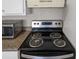 Close-up of stovetop and microwave in kitchen at 1020 Alladin Dr, Deltona, FL 32725