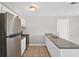 Eat-in kitchen with stainless steel appliances and granite countertops at 1020 Alladin Dr, Deltona, FL 32725