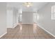 Bright living room with ceramic tile flooring, ceiling fan and neutral paint palette at 1020 Alladin Dr, Deltona, FL 32725