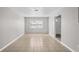 Neutral-toned living room with a large window at 1020 Alladin Dr, Deltona, FL 32725