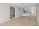A spacious living area with tile flooring leading to kitchen at 1020 Alladin Dr, Deltona, FL 32725