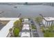 Aerial view showcasing the community's waterfront location, pool, and convenient parking at 108 Mitchell Pl # 108, Daytona Beach, FL 32118