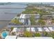 Aerial view of waterfront community, showcasing a swimming pool, parking, and water access at 108 Mitchell Pl # 108, Daytona Beach, FL 32118