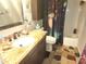 Bathroom with a unique granite vanity top and a custom shower curtain at 108 Mitchell Pl # 108, Daytona Beach, FL 32118
